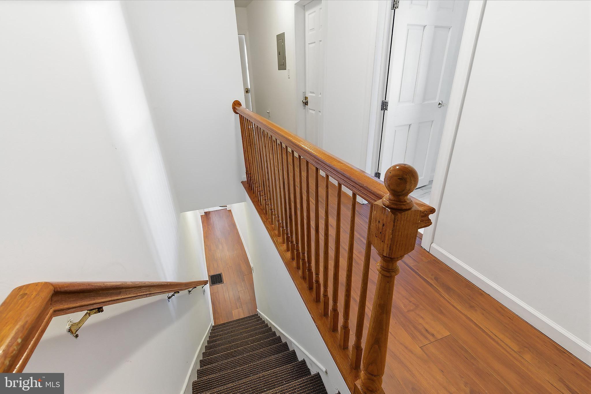 233 Ellis Street Burlington, NJ 08016 - Photo 13 of 36 a view of staircase with railing and white walls