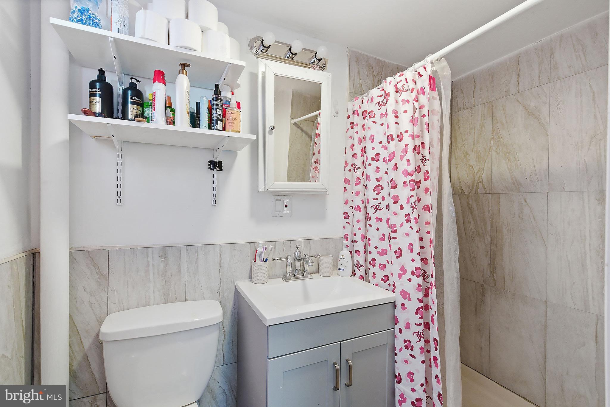 233 Ellis Street Burlington, NJ 08016 - Photo 14 of 36 a bathroom with a sink and a toilet