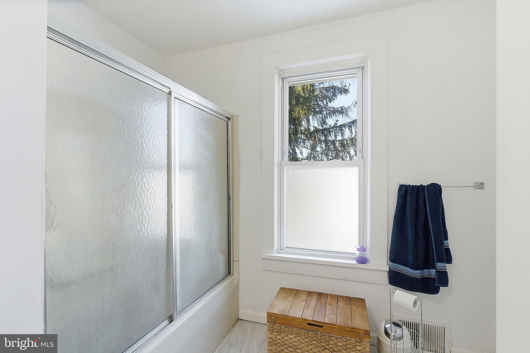 233 Ellis Street Burlington, NJ 08016 - Photo 17 of 36 a bathroom with a shower and a window