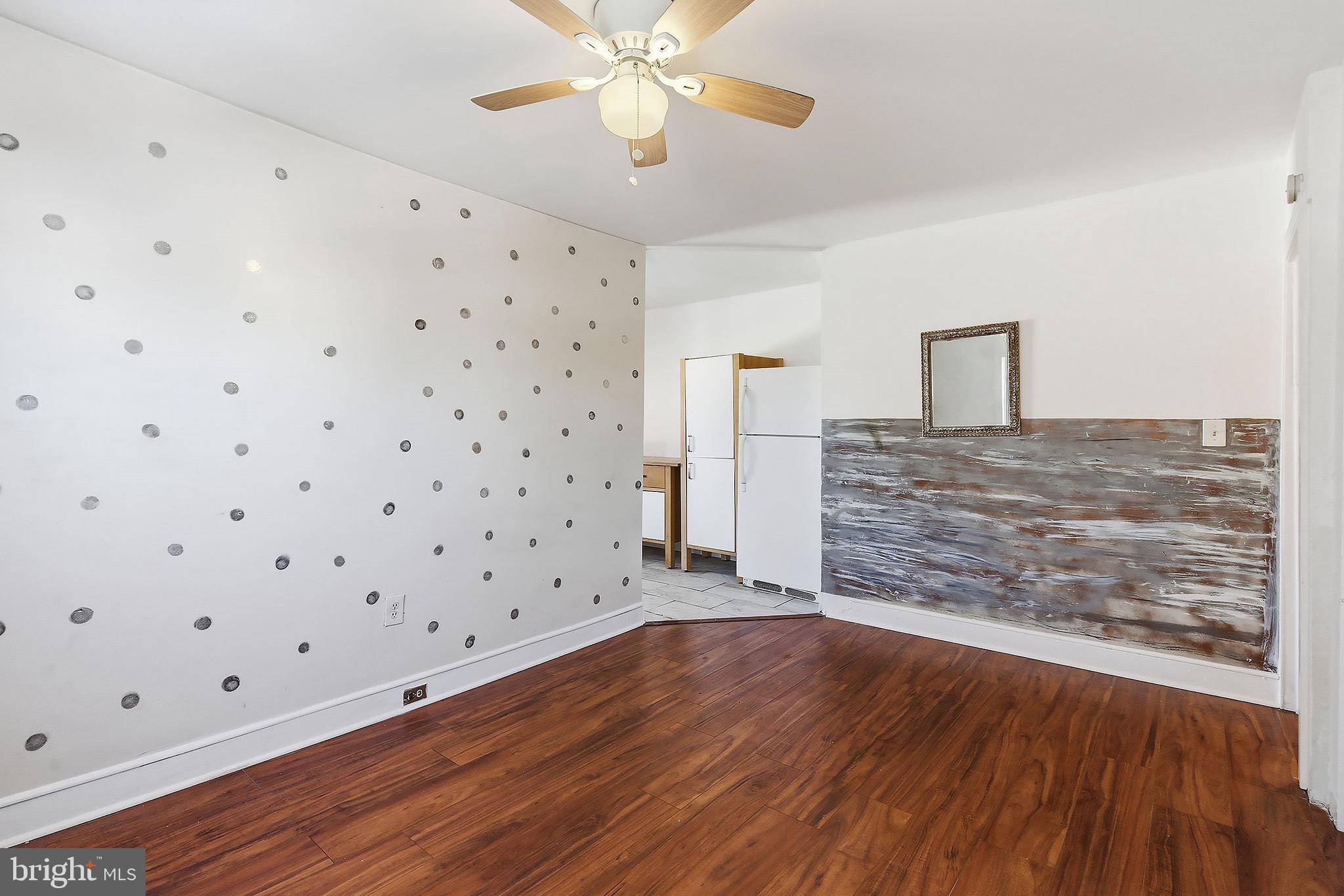 233 Ellis Street Burlington, NJ 08016 - Photo 19 of 36 a view of an empty room with window and wooden floor