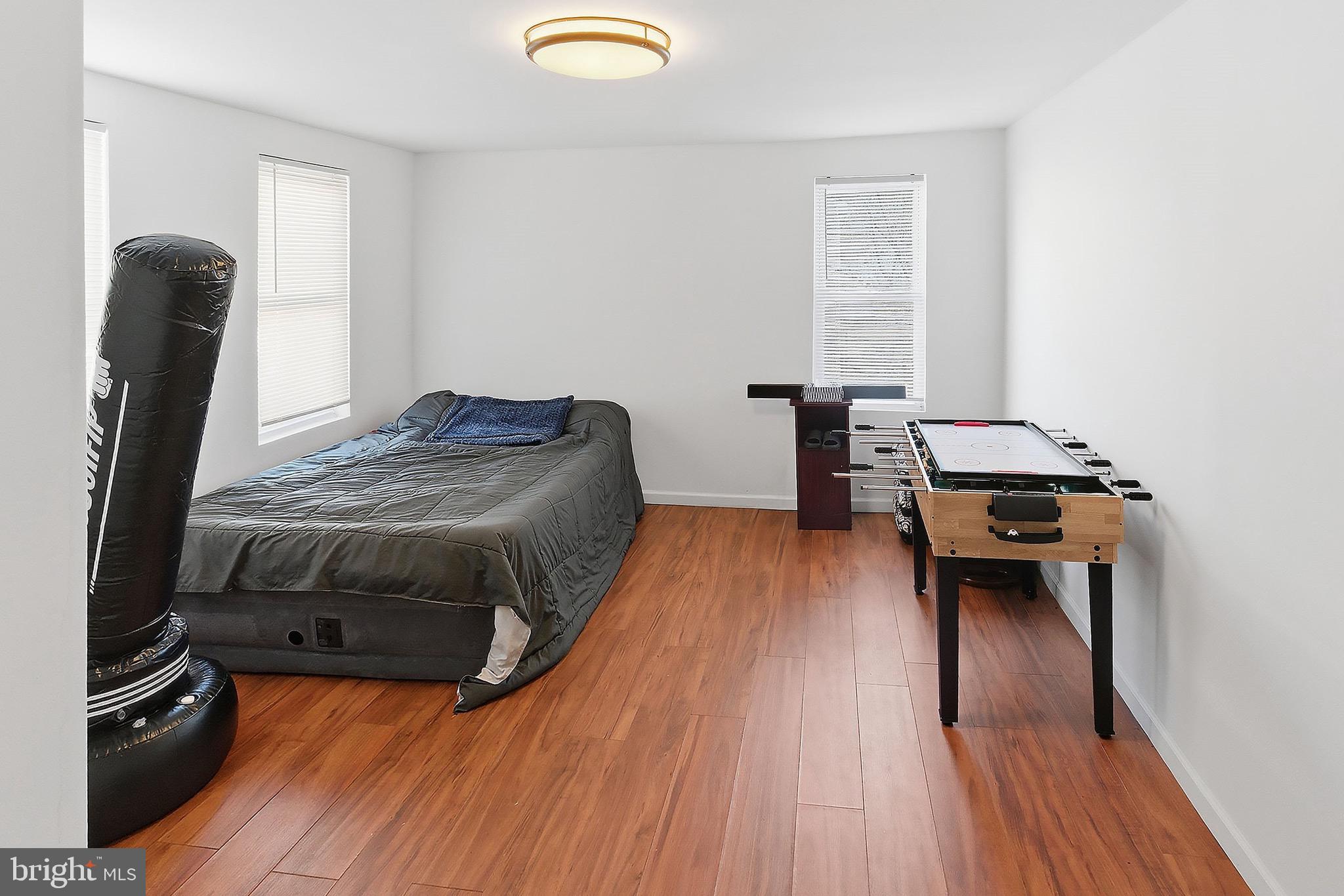 233 Ellis Street Burlington, NJ 08016 - Photo 21 of 36 a bedroom with a bed and wooden floor
