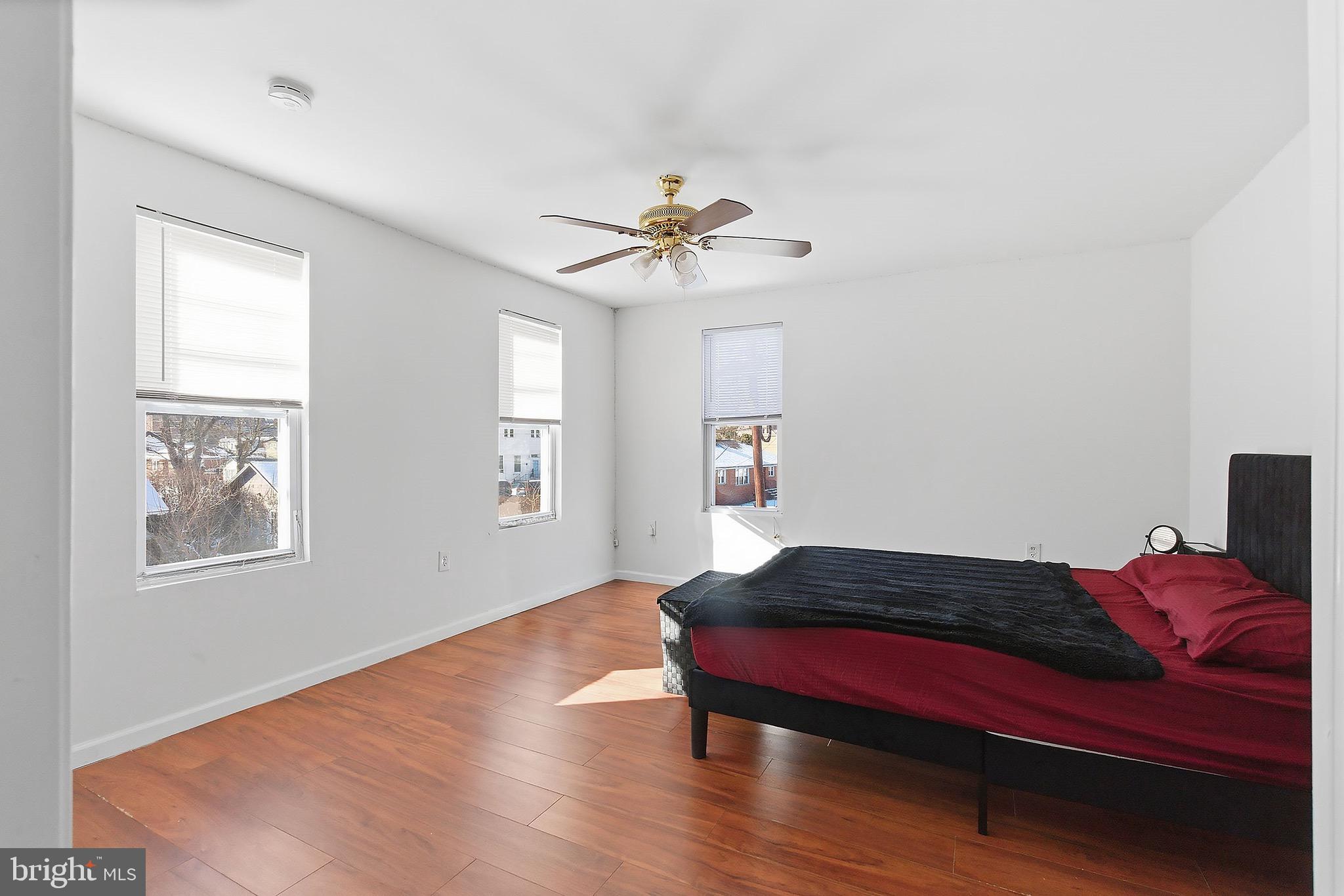 233 Ellis Street Burlington, NJ 08016 - Photo 24 of 36 a bedroom with a bed and wooden floor