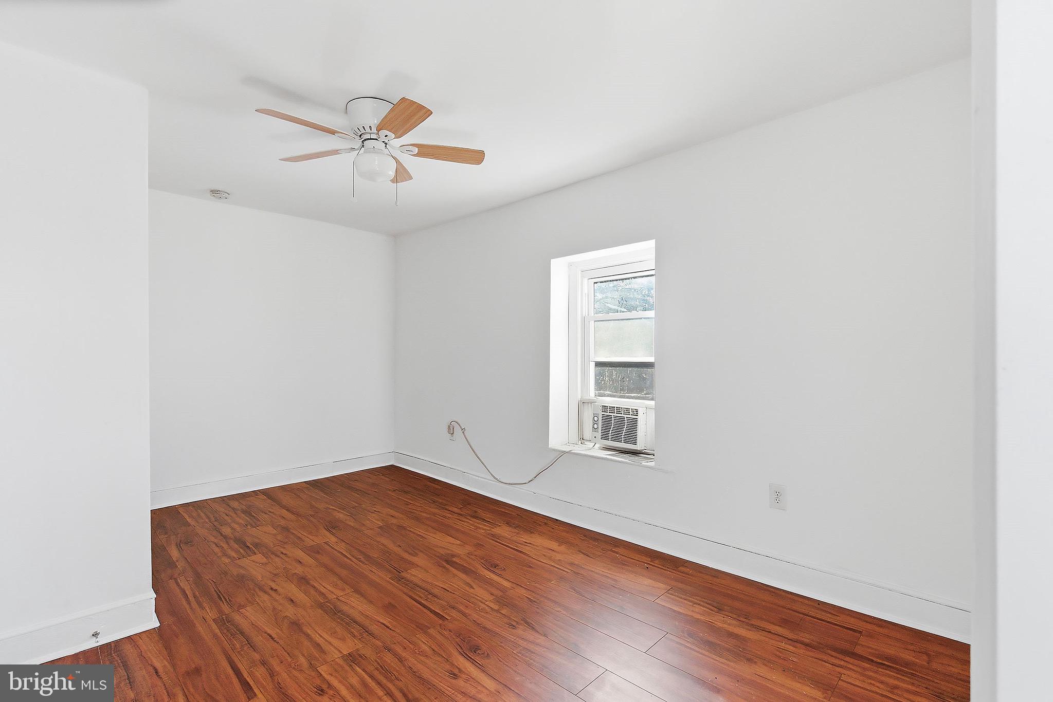 233 Ellis Street Burlington, NJ 08016 - Photo 26 of 36 an empty room with wooden floor fan and windows