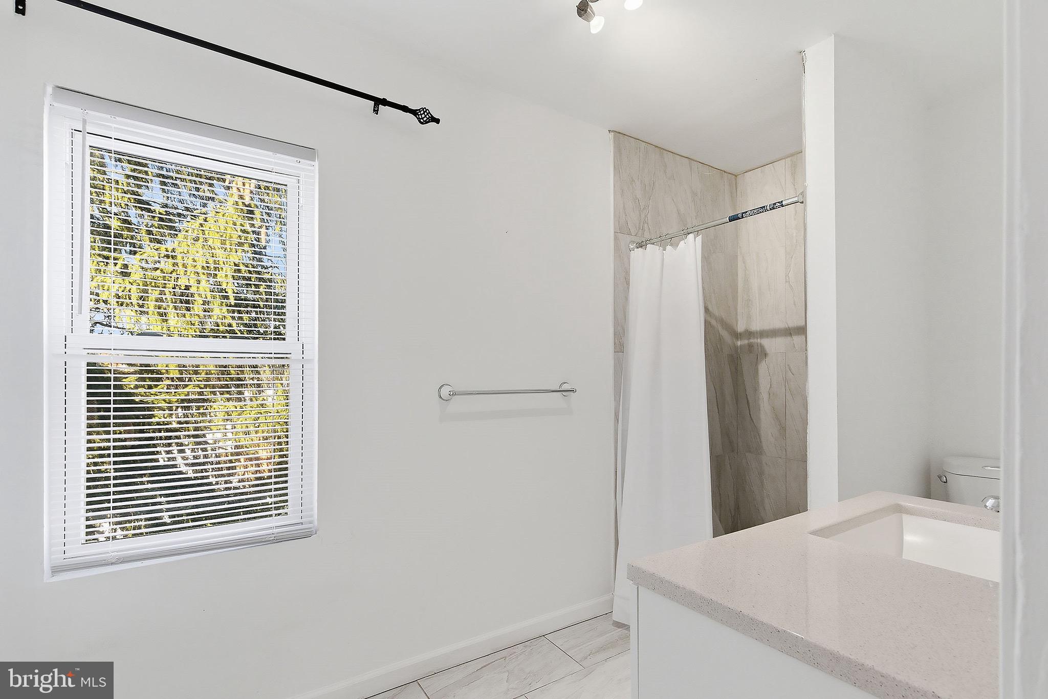 233 Ellis Street Burlington, NJ 08016 - Photo 27 of 36 a room that has a window in it and a white sink