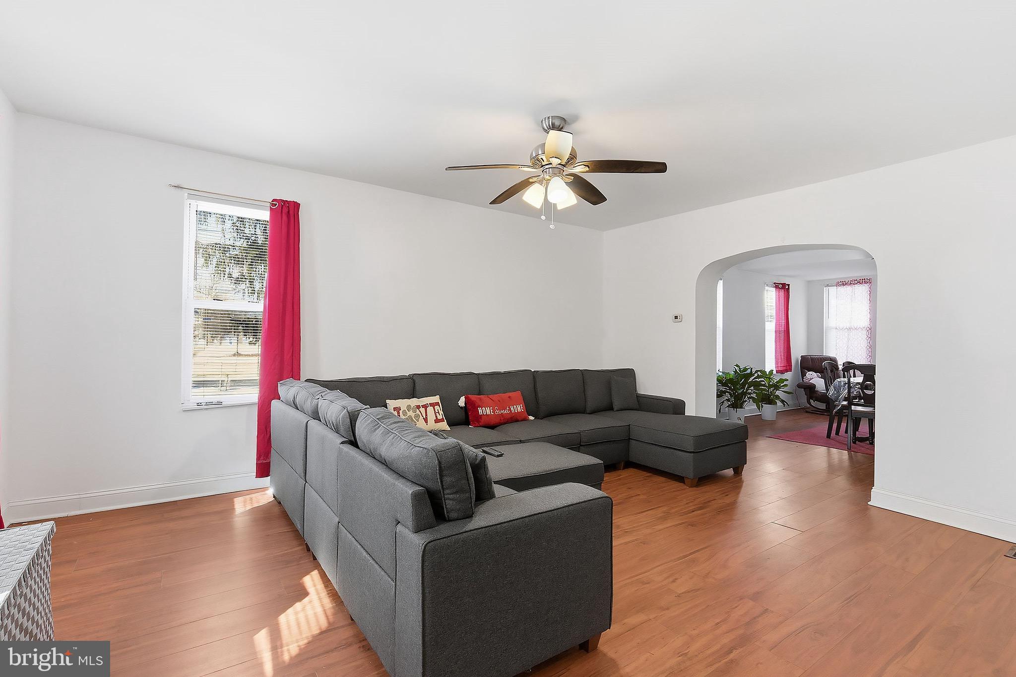 233 Ellis Street Burlington, NJ 08016 - Photo 5 of 36 a living room with furniture kitchen view and a wooden floor