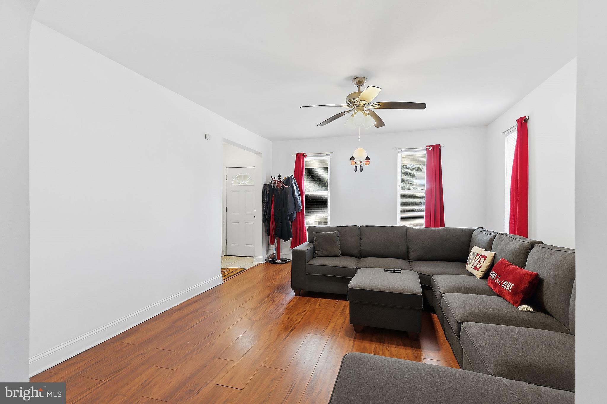 233 Ellis Street Burlington, NJ 08016 - Photo 6 of 36 a living room with furniture and a wooden floor