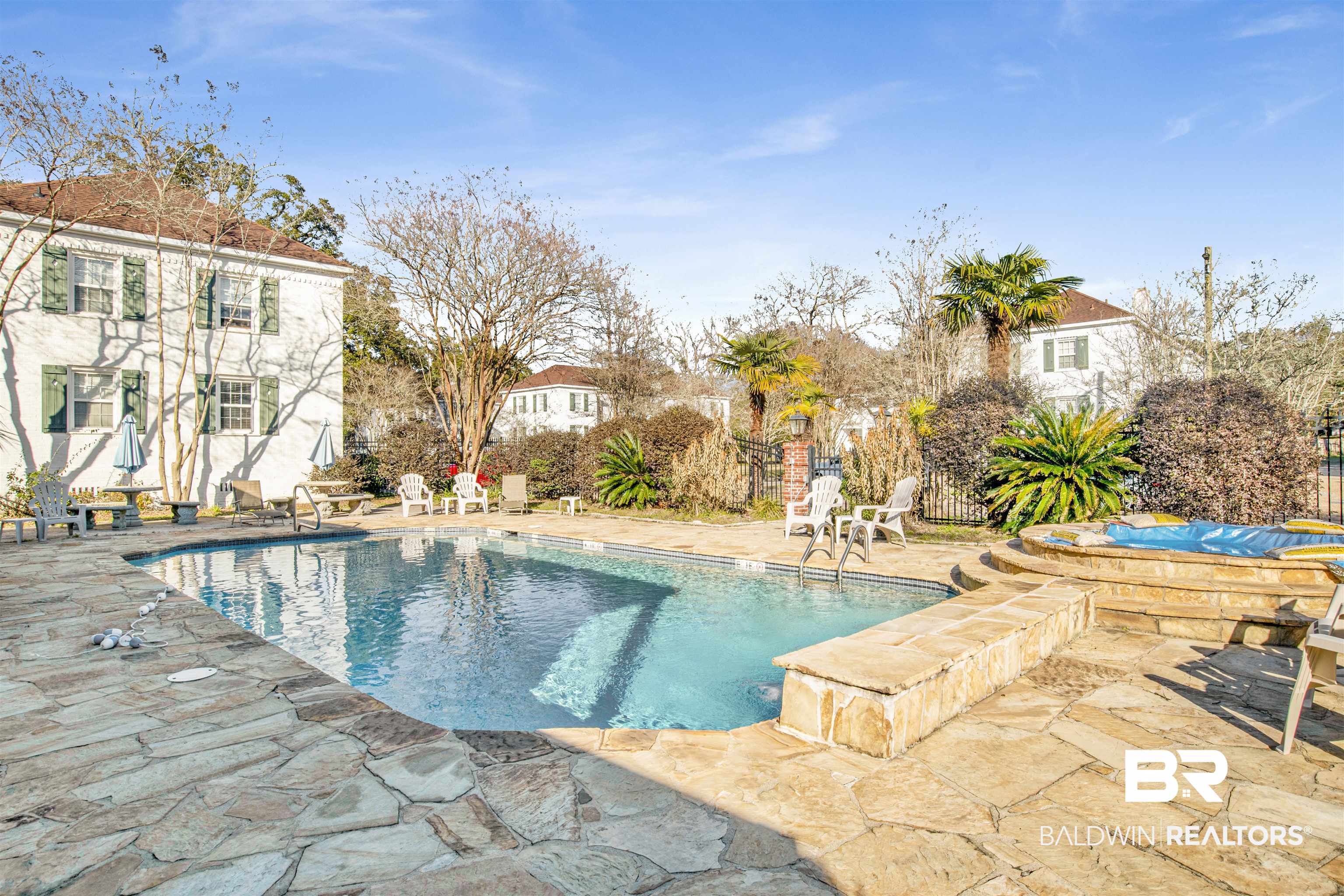 214 Upham Street, Unit 7A Mobile, AL 36607 - Photo 32 of 35 View of swimming pool featuring a patio and a hot tub