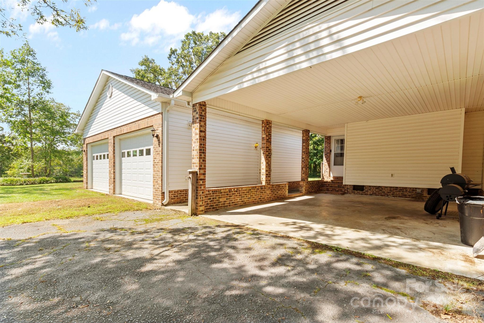 1220 Shiloh Ranch Road Lancaster, SC 29720 - Photo 28 of 35 a view of a house with backyard and trees