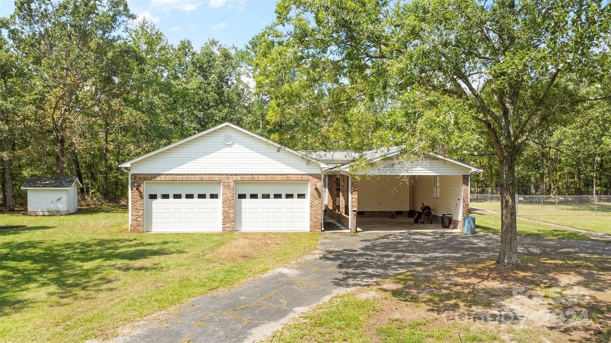 1220 Shiloh Ranch Road Lancaster, SC 29720 - Photo 3 of 35 a view of house with yard and trees in the background