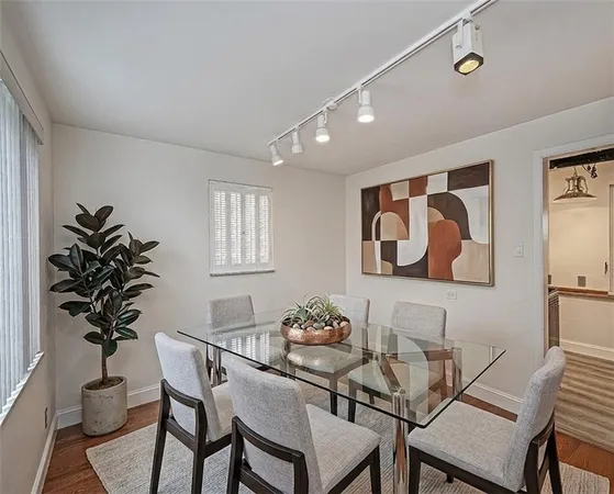 a view of a livingroom with furniture and a potted plant