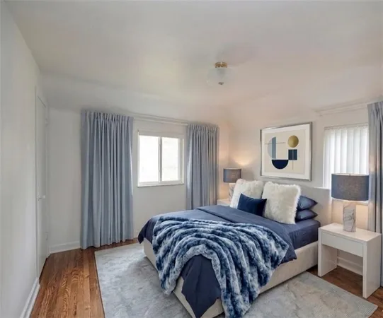 a bedroom with a bed and a lamp