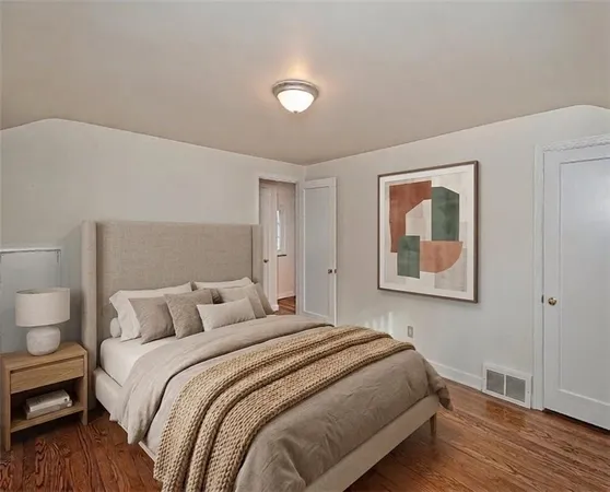 a bedroom with a bed and a view of bathroom