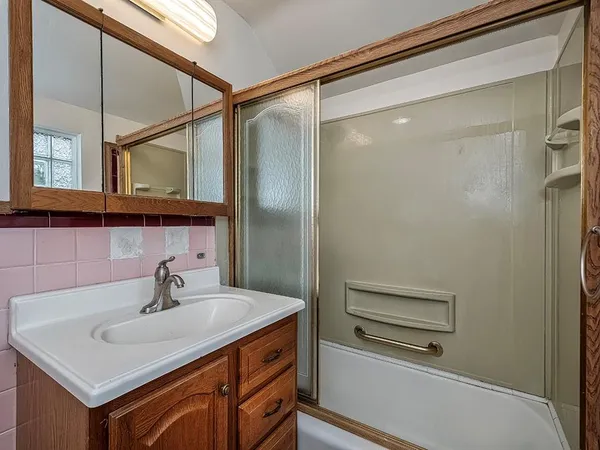 a bathroom with a sink and a mirror
