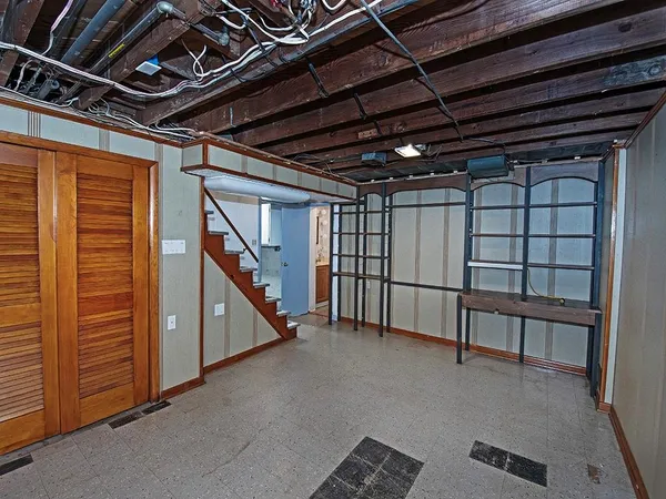 a view of an empty room with white walls