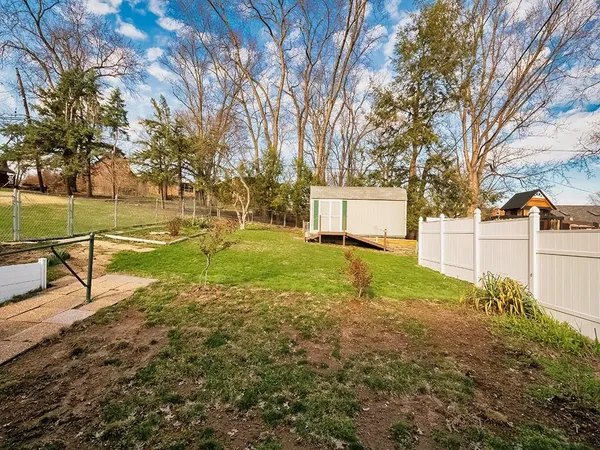 a view of backyard with green space