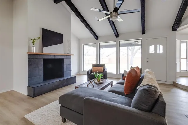 a living room with furniture and a fireplace