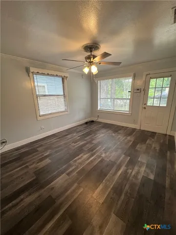 a view of an empty room with a window