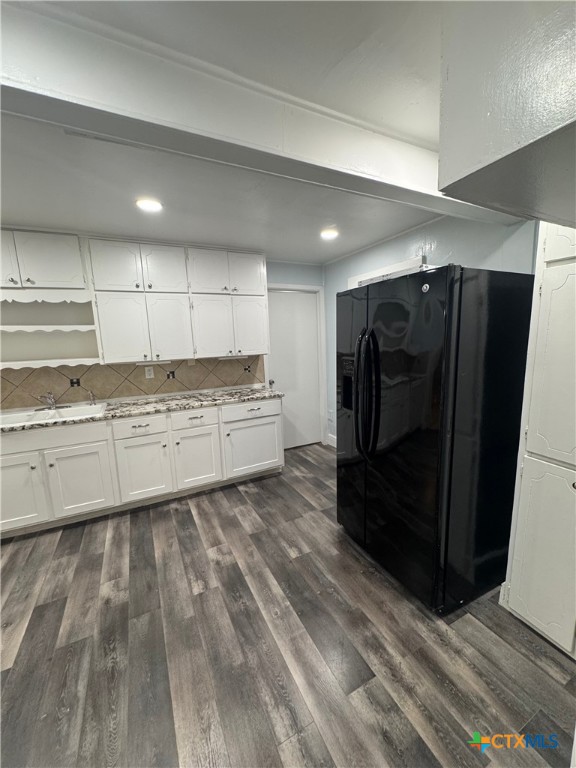 1705 Holly Street Austin, TX 78702 - Photo 8 of 21 a kitchen with stainless steel appliances kitchen island granite countertop a refrigerator and a stove top oven