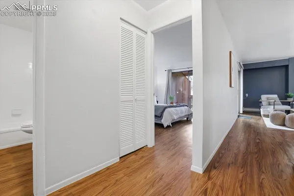 a view of a porch with wooden floor and floor to ceiling window