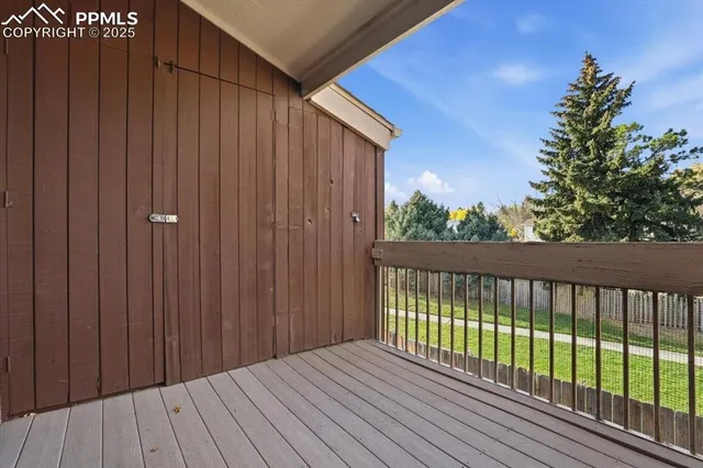 a terrace with a sink and wooden floor