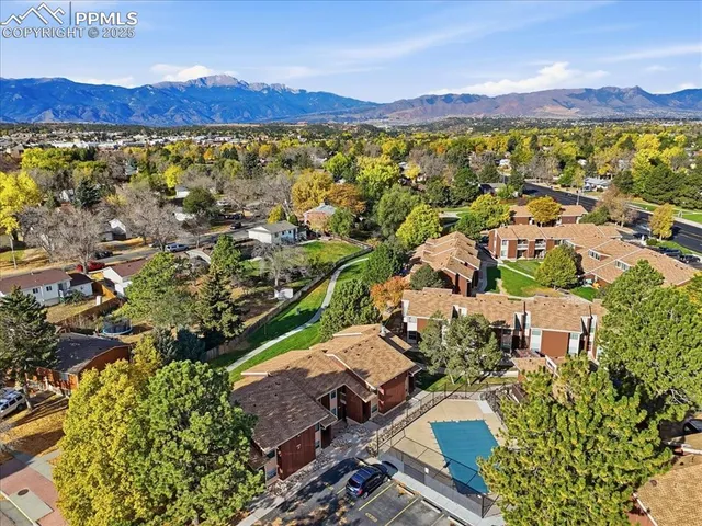 an aerial view of residential houses with outdoor space