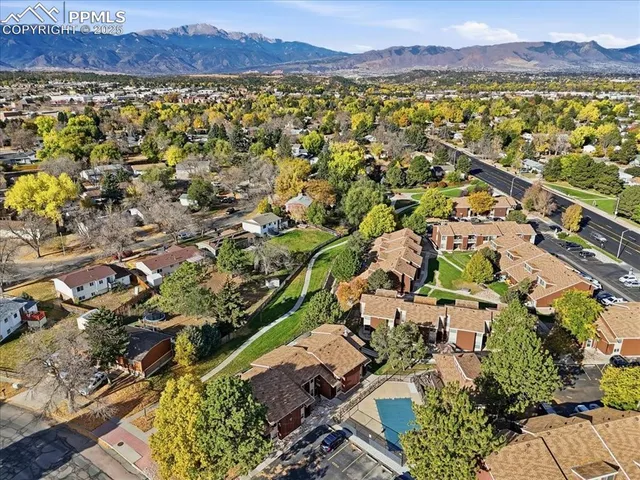 an aerial view of a house with outdoor space