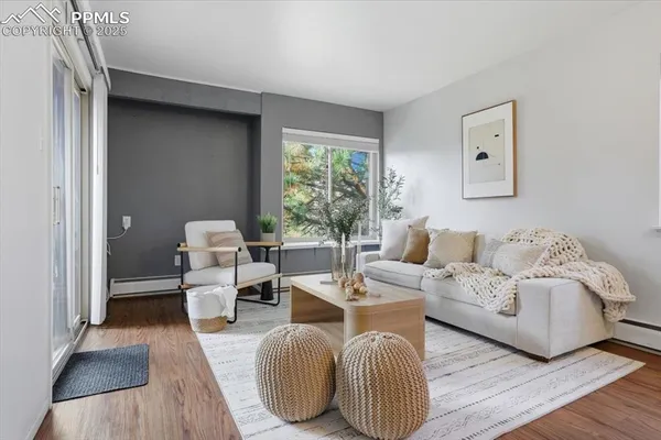 a living room with furniture and a window