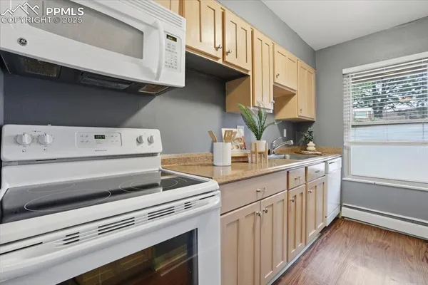 a kitchen with a stove microwave and a sink