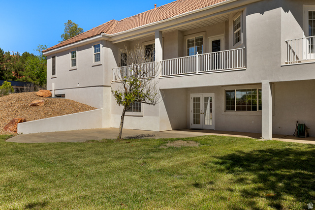 389 North Main Street St. George, UT 84770 - Photo 39 of 44 Back of house with french doors, stucco siding, a balcony, and a patio area