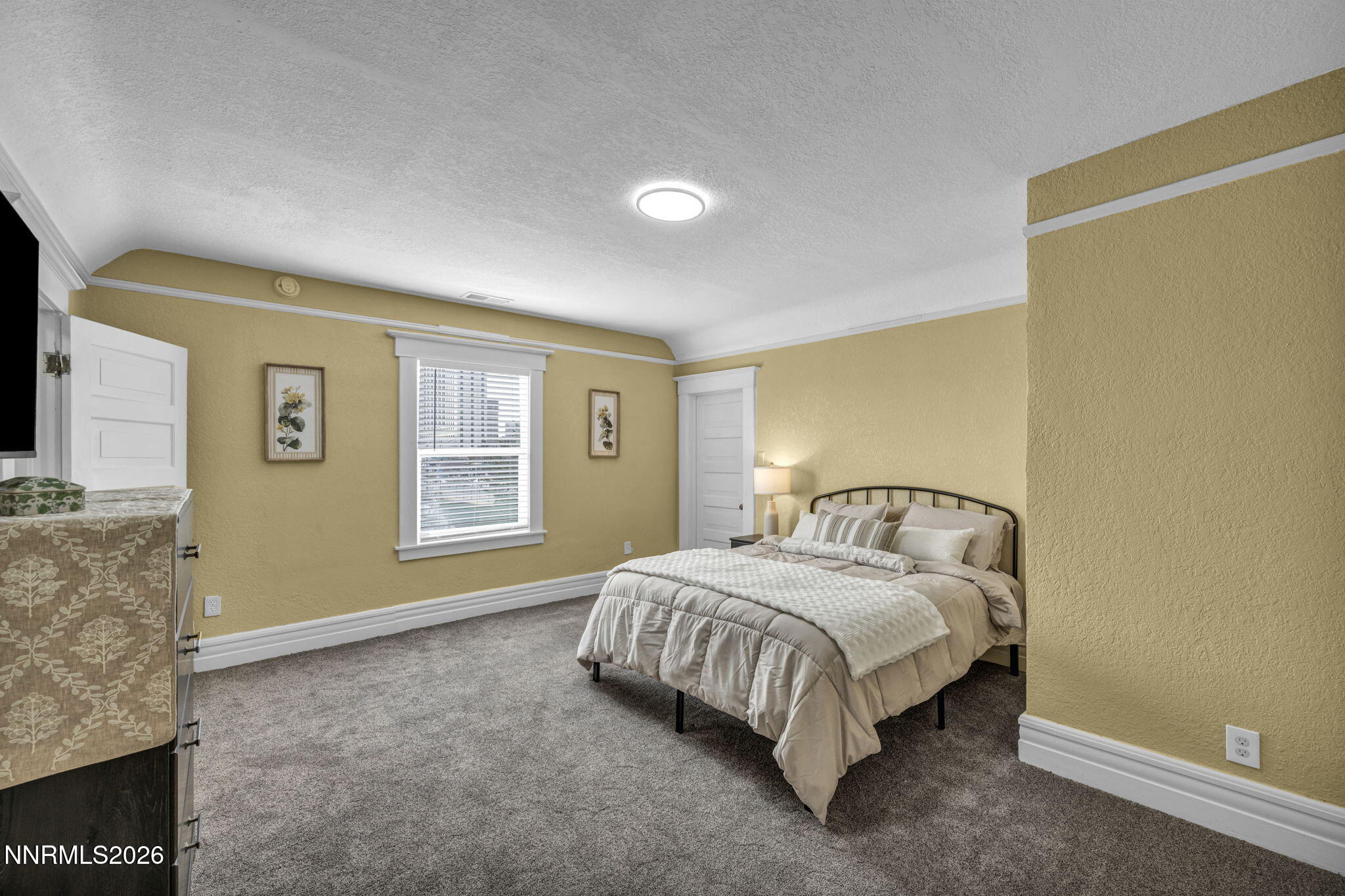 35 West 8th Street Reno, NV 89503 - Photo 22 of 62 a bedroom with a bed and a flat screen tv