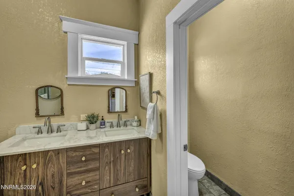 a bathroom with a shower and a window