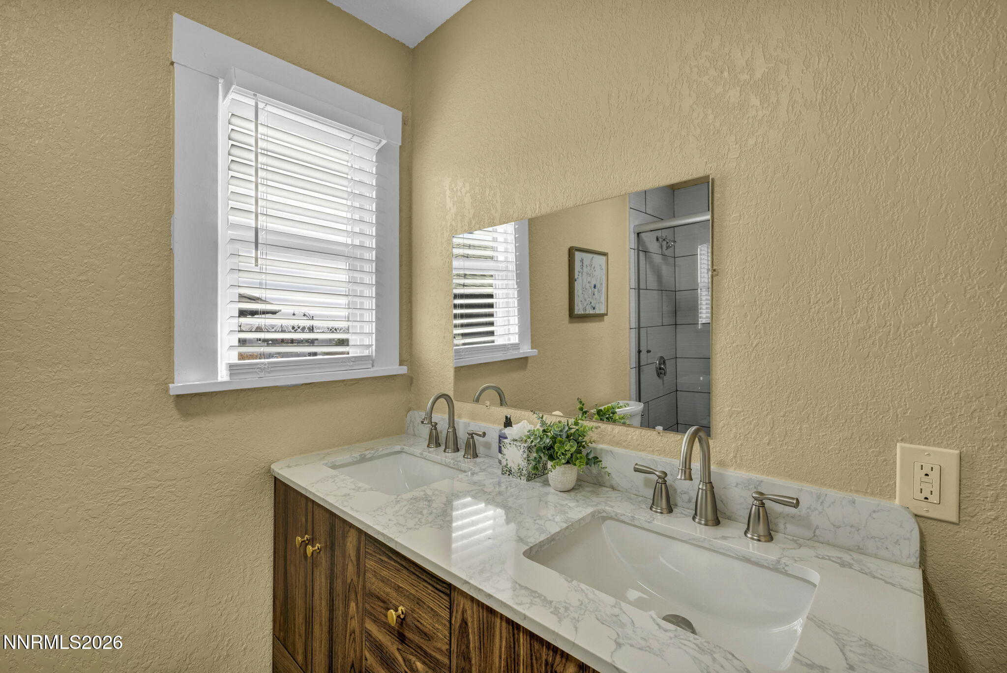 35 West 8th Street Reno, NV 89503 - Photo 27 of 62 a bathroom with a granite countertop sink a mirror and a window