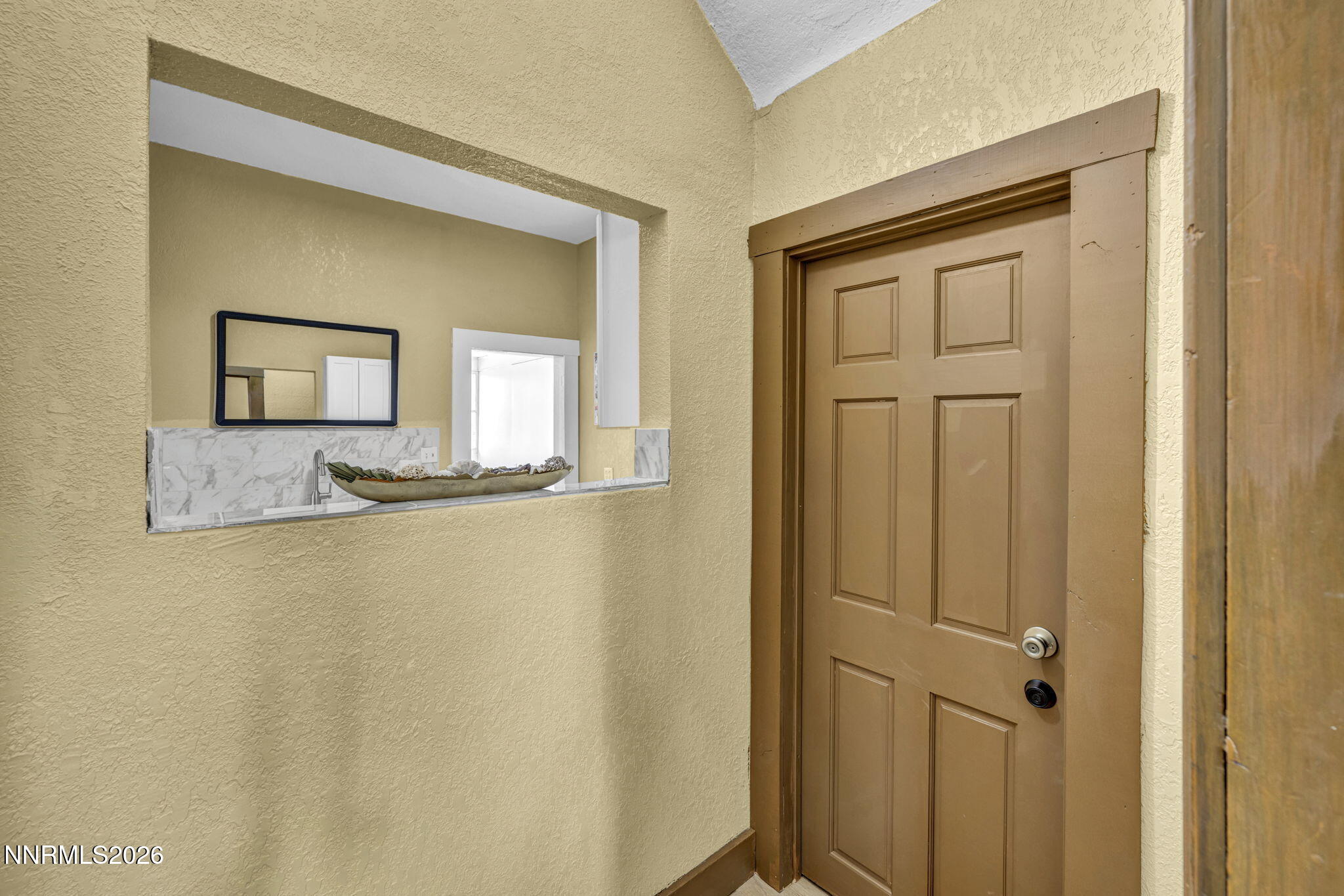 35 West 8th Street Reno, NV 89503 - Photo 37 of 62 a bathroom with a granite countertop sink and a mirror