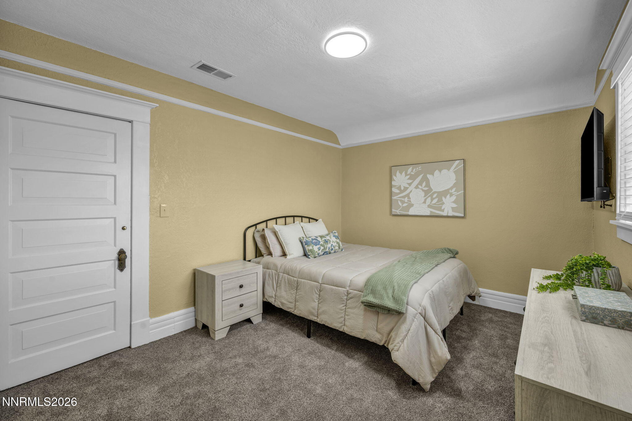 35 West 8th Street Reno, NV 89503 - Photo 42 of 62 a bedroom with a bed and a painting on the wall