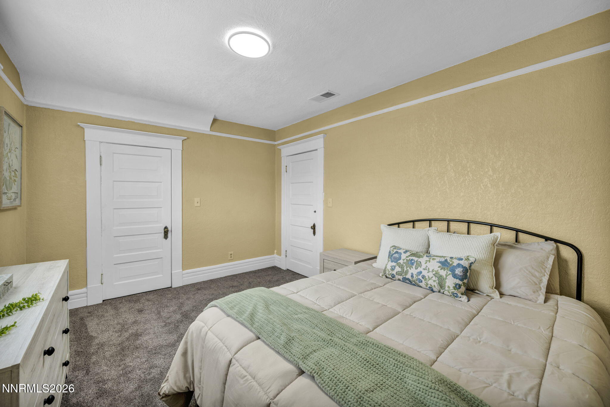 35 West 8th Street Reno, NV 89503 - Photo 43 of 62 a bedroom with a large bed and walk in closet