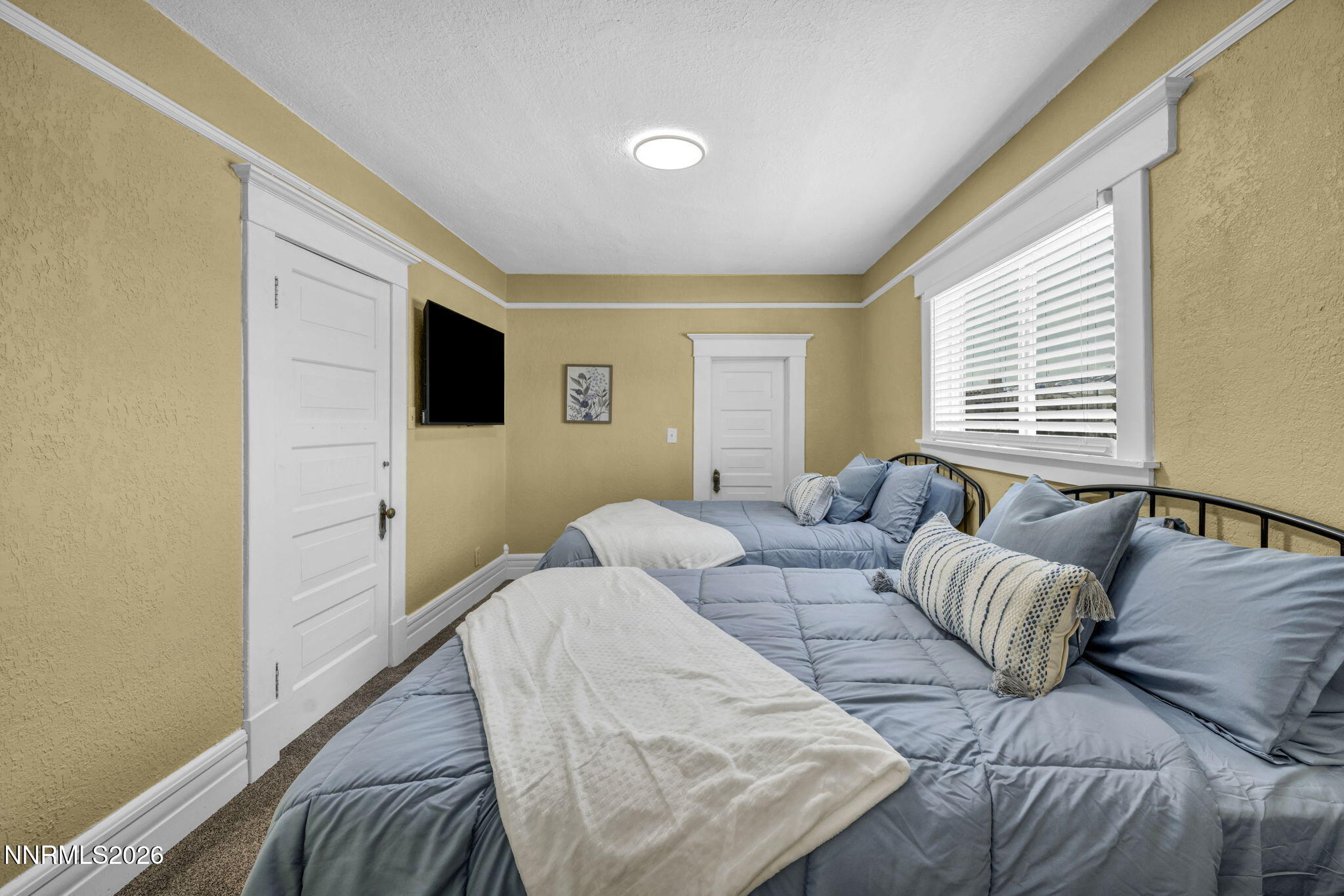 35 West 8th Street Reno, NV 89503 - Photo 46 of 62 a bedroom with a bed and a couch