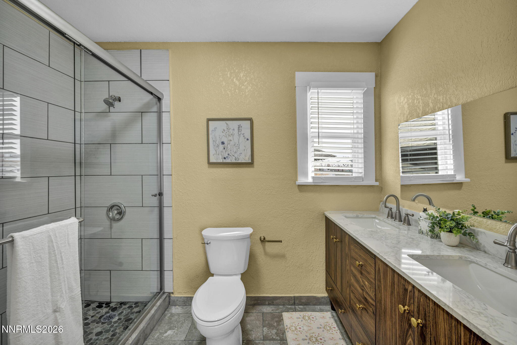 35 West 8th Street Reno, NV 89503 - Photo 50 of 62 a bathroom with a granite countertop toilet sink and mirror