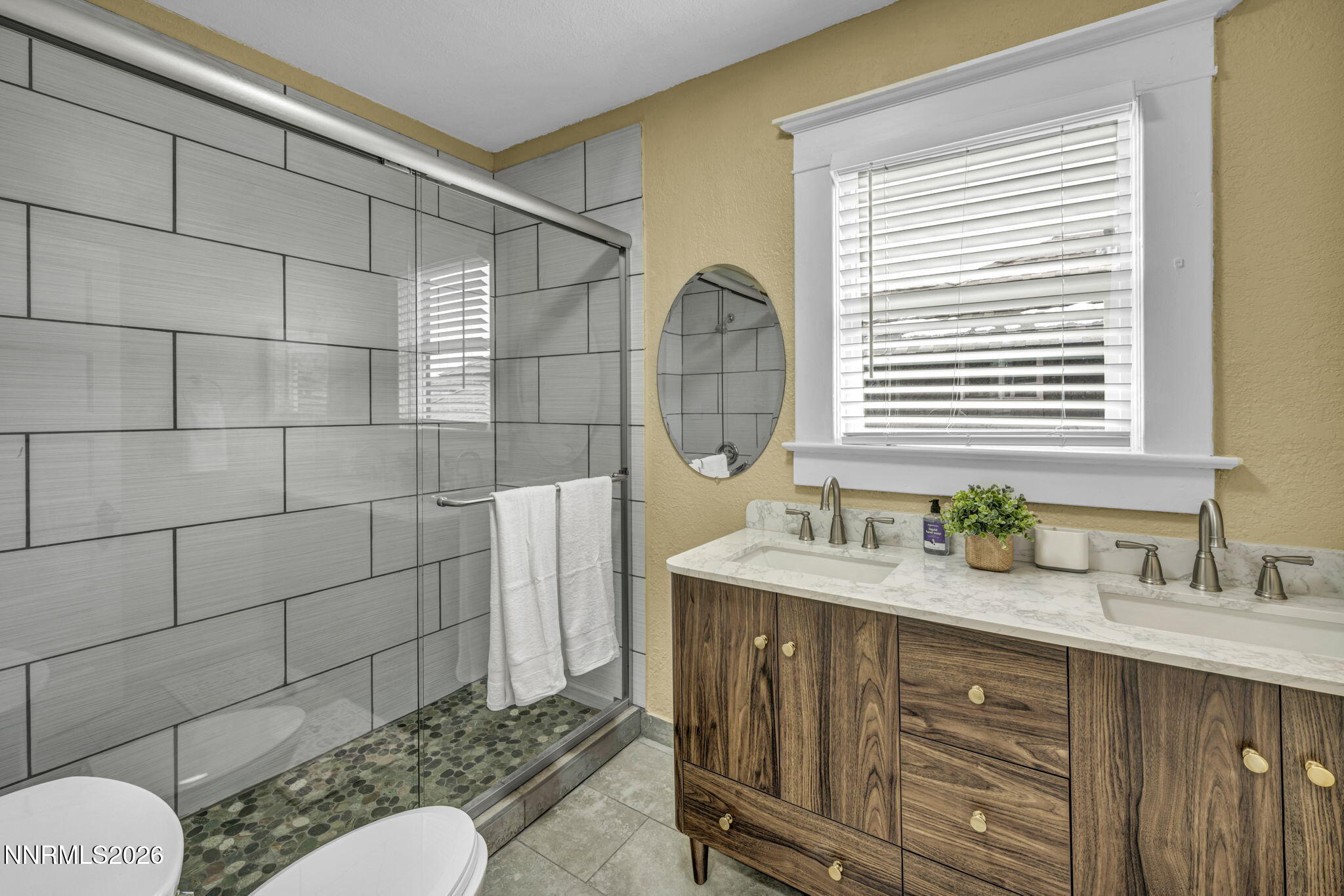 35 West 8th Street Reno, NV 89503 - Photo 53 of 62 a bathroom with a granite countertop sink vanity mirror and toilet
