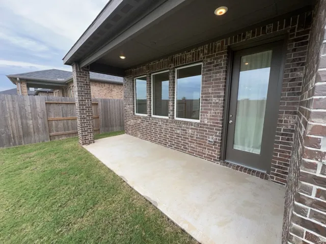 a view of house with backyard