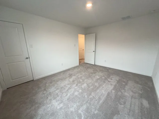 a view of an empty room and entryway