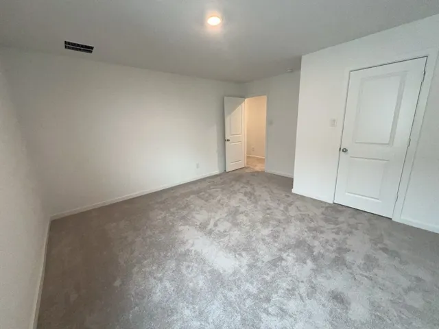 a view of an empty room and entryway