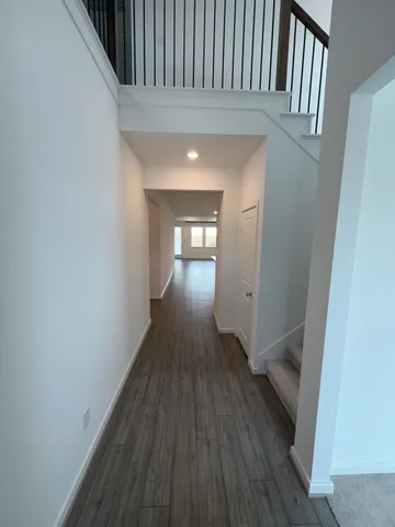 a view of gallery with wooden floor