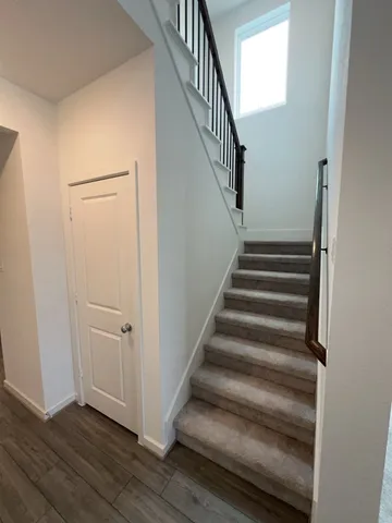 a view of entryway with wooden floor