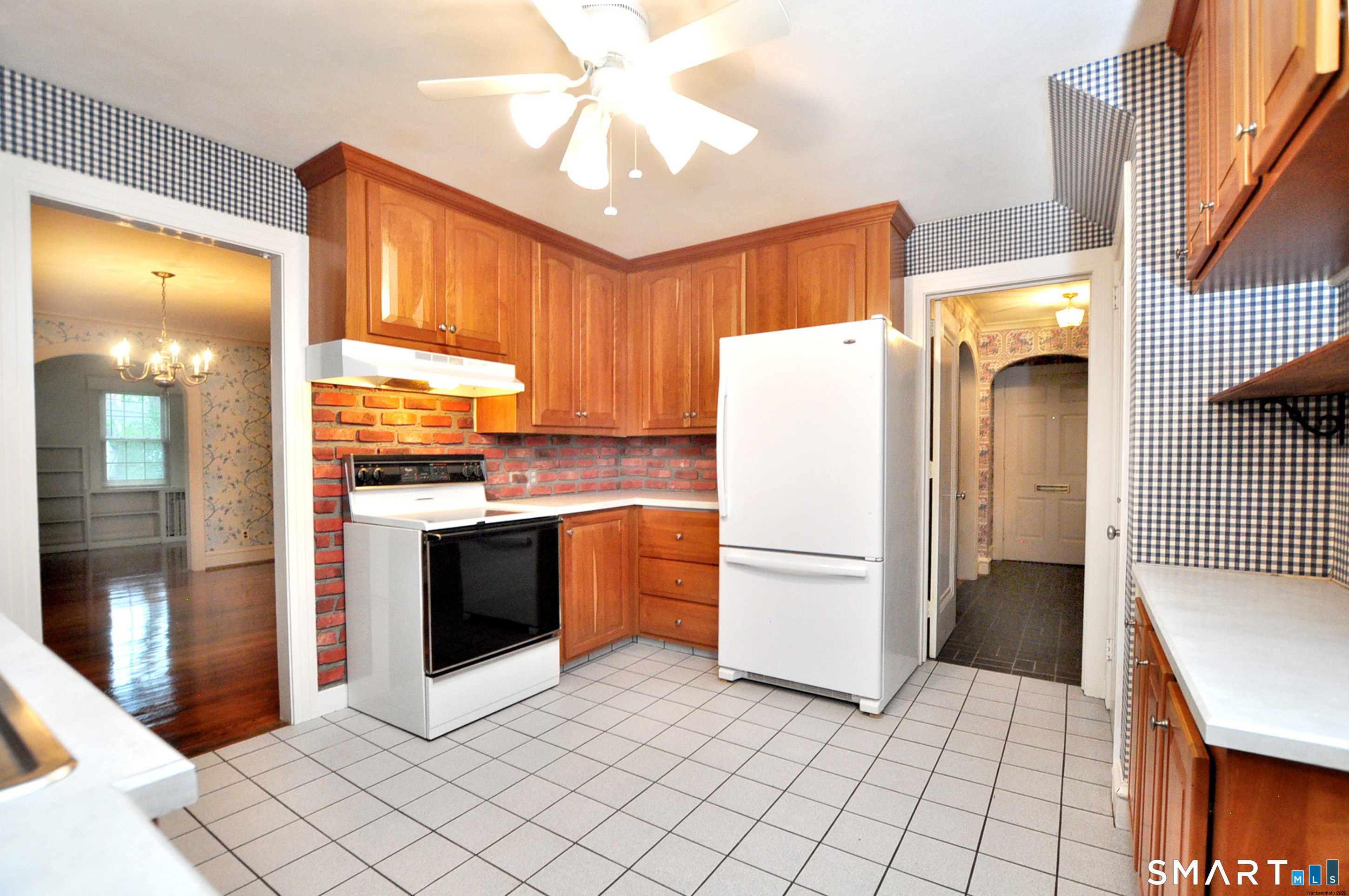 10 Harvey Road Windsor, CT 06095 - Photo 9 of 36 a kitchen with stainless steel appliances a refrigerator and a stove top oven