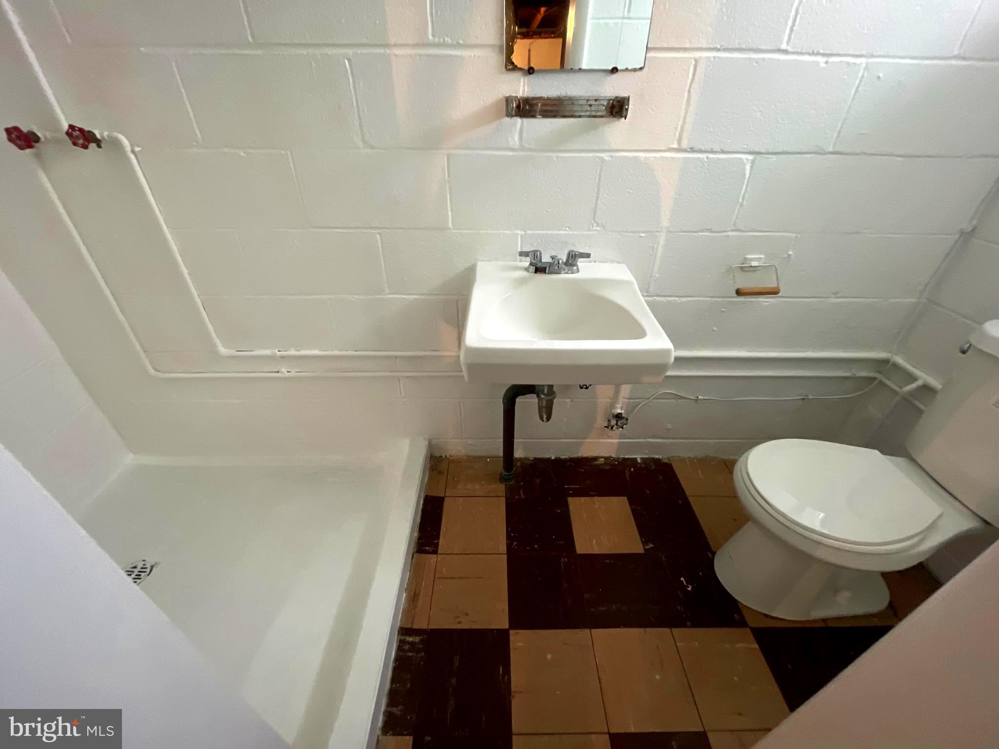 6804 Lenbern Road Baltimore, MD 21207 - Photo 14 of 17 a bathroom with a sink and a mirror
