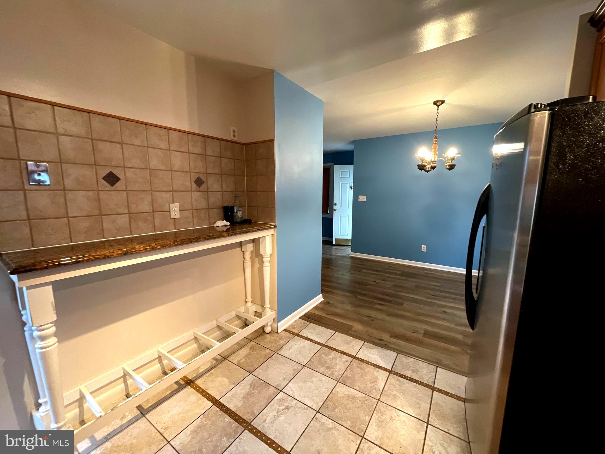 6804 Lenbern Road Baltimore, MD 21207 - Photo 4 of 17 a bathroom with a sink a mirror and shower
