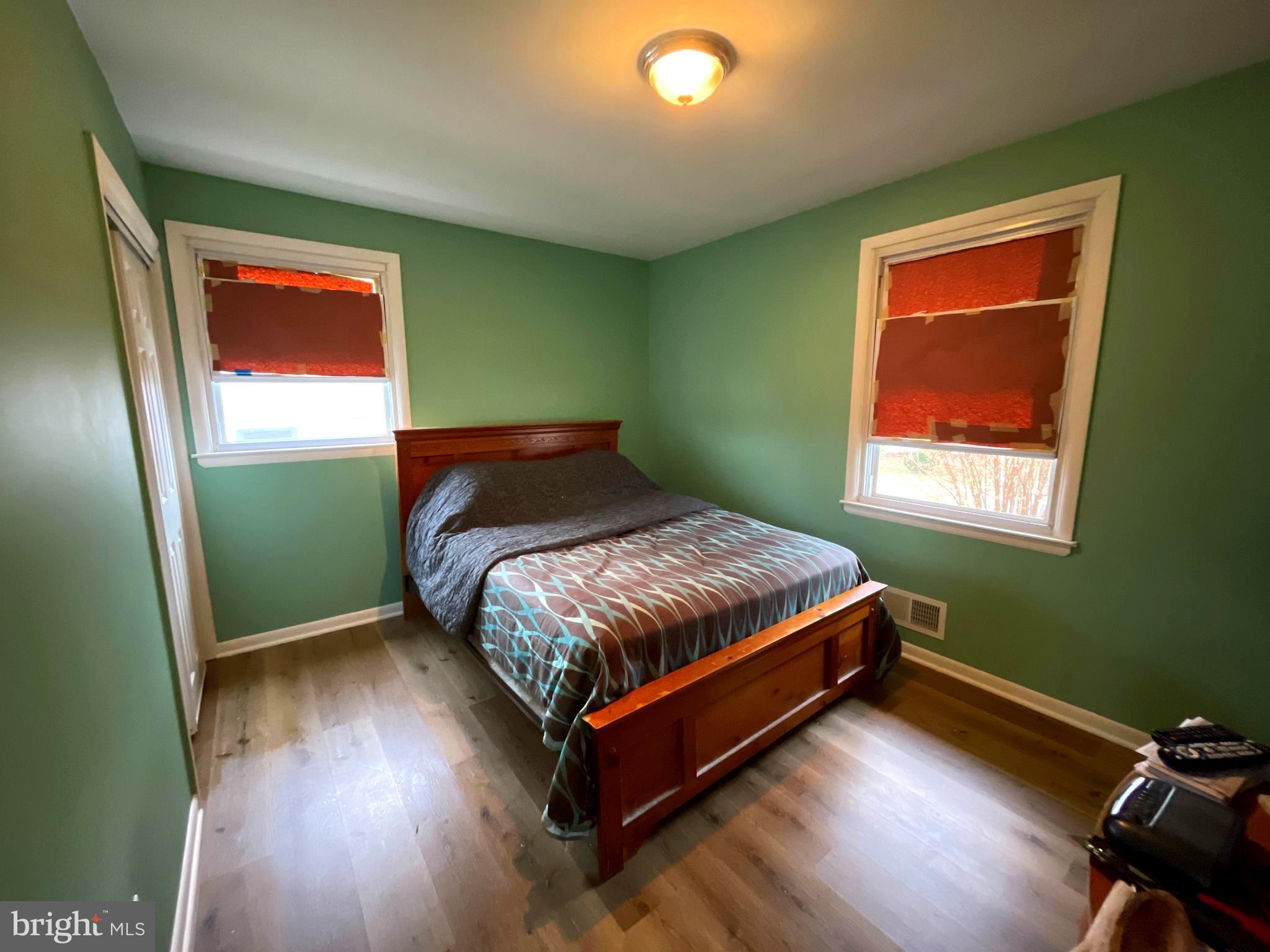 6804 Lenbern Road Baltimore, MD 21207 - Photo 9 of 17 a bedroom with a bed and window