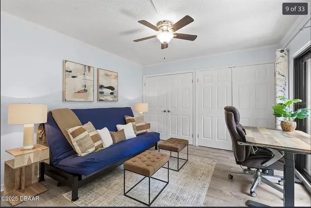 a workspace with a couch and a potted plant