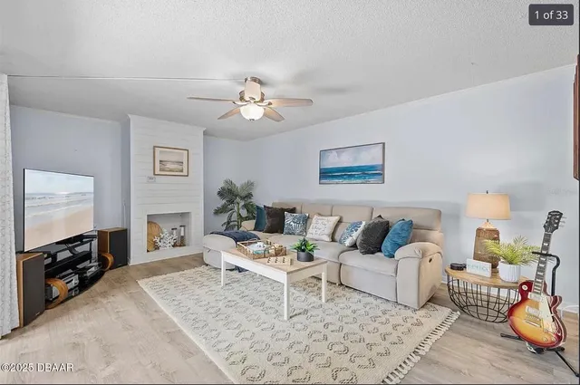 a living room with furniture and a flat screen tv