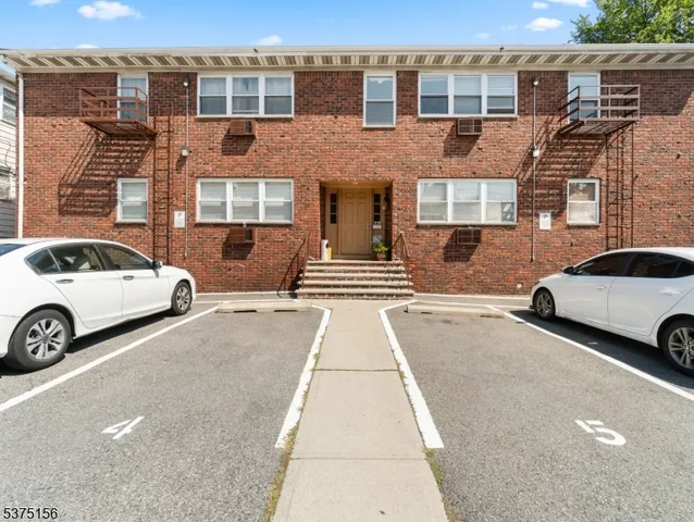 a view of a car parked in front of a building